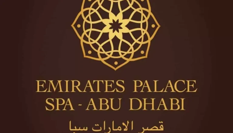 A logo featuring a golden geometric design at the top with the text "EMIRATES PALACE SPA - ABU DHABI" in gold below, followed by Arabic text. The background is dark brown.
