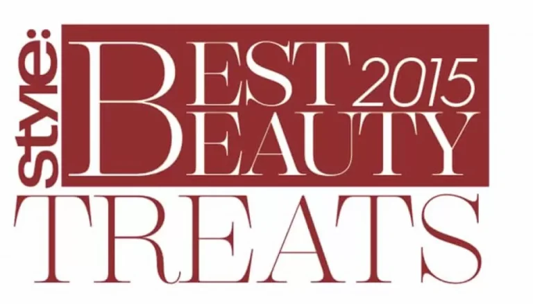 The image features the text "style: BEST BEAUTY TREATS 2015" in a bold, elegant font. The word "style:" is oriented vertically on the left side, while the rest of the text is stacked horizontally in a mix of large and small lettering.